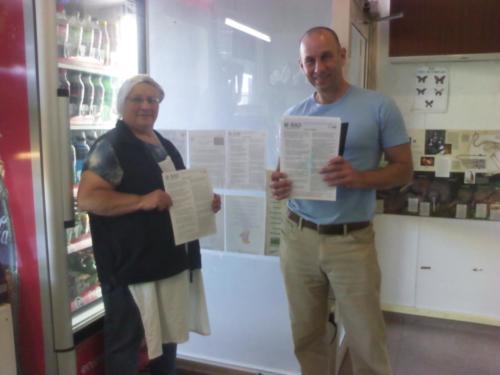 2018 - Wayne putting W-BAD pamplets on noticeboard of local bakery in Taranaki, NZ