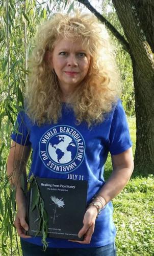 Cold turkey miracle and BZ survivor Salyann from West Virginia holding Healing from Psychiatry book by Alison